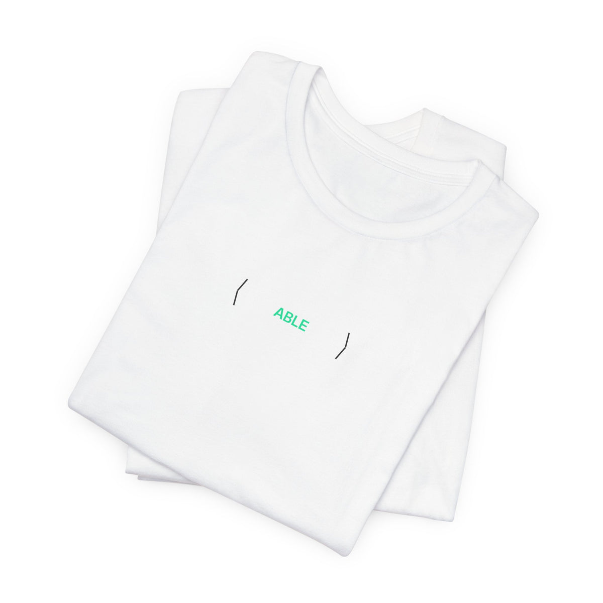 Folded white PREDICTABLE ABLE (Stealth) Unisex Tee showing the front graphic.