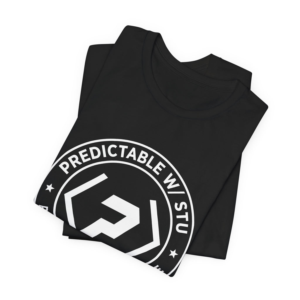 Folded black PREDICTABLE Badge Crest Tee showing the front graphic.