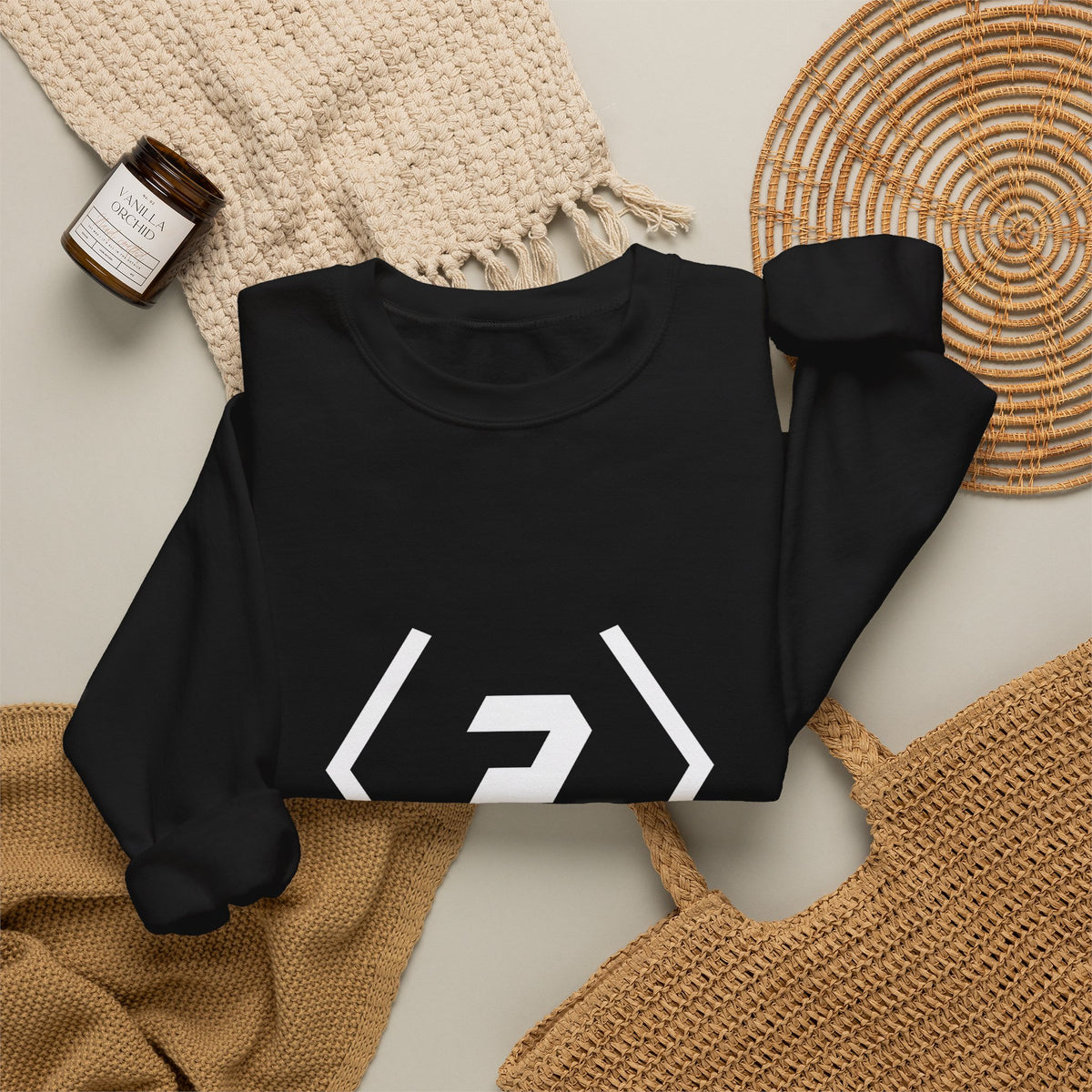 Folded black PREDICTABLE Official Logo Crewneck Sweatshirt arranged with neutral knit accessories.