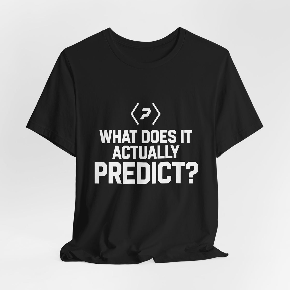 Black PREDICTABLE What Does It Actually Predict Tee draped against a light gray backdrop.