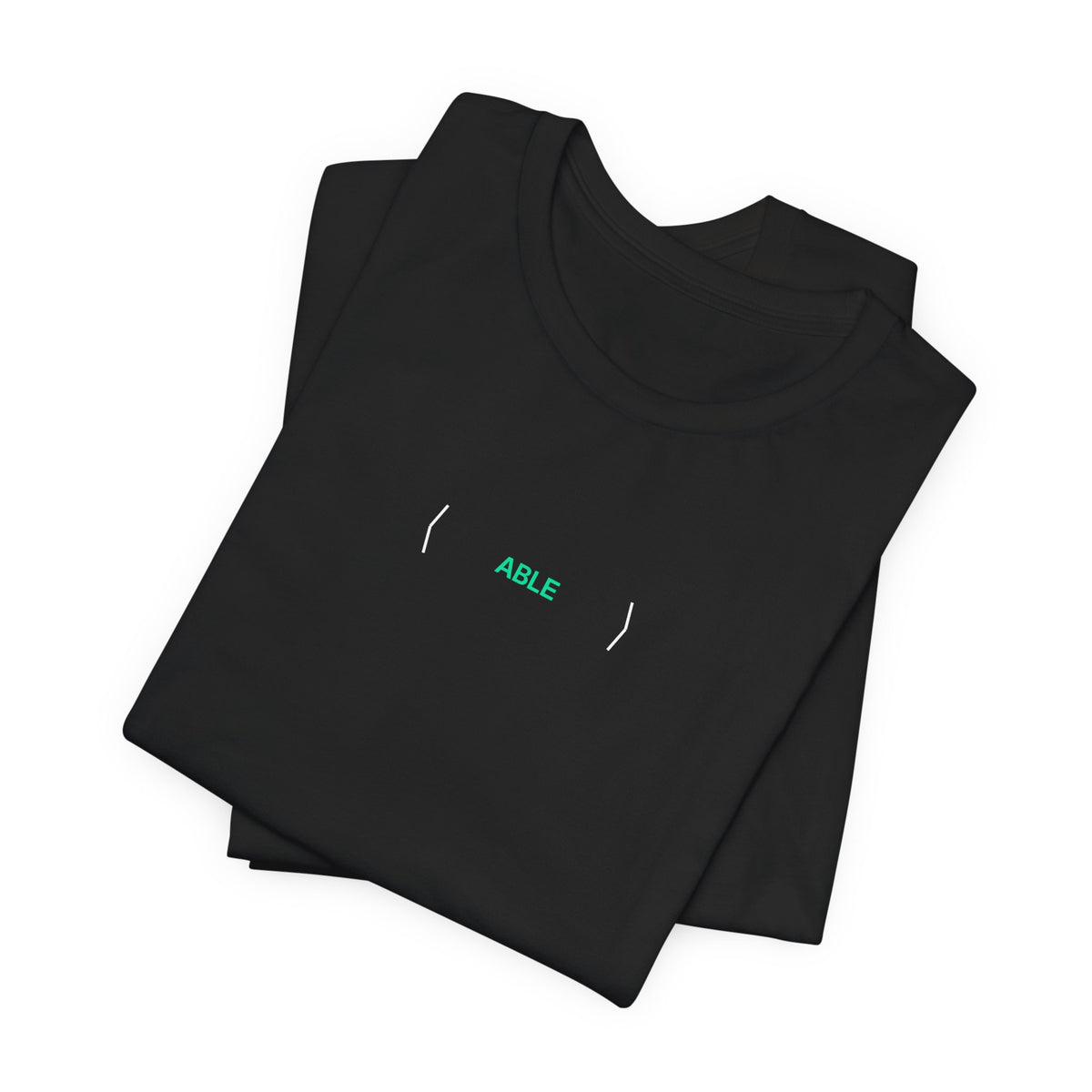 Folded black PREDICTABLE ABLE (Stealth) Unisex Tee showing the front graphic.